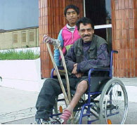 bettelnder Rollstuhlfahrer
